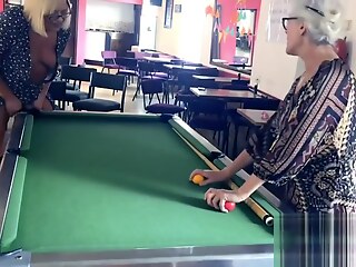 Angels enjoy a game of pool, using each other's sensitive areas as targets.